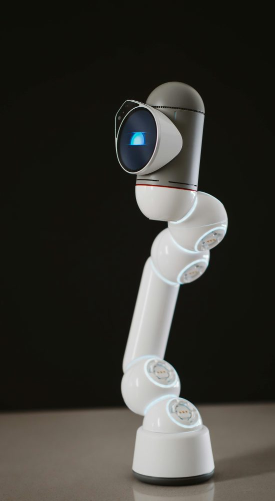 A sleek, futuristic robotic arm against a dark background showcasing modern technology.